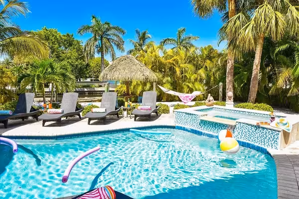 Pool and waterfront setting at Sirenia By The Sea